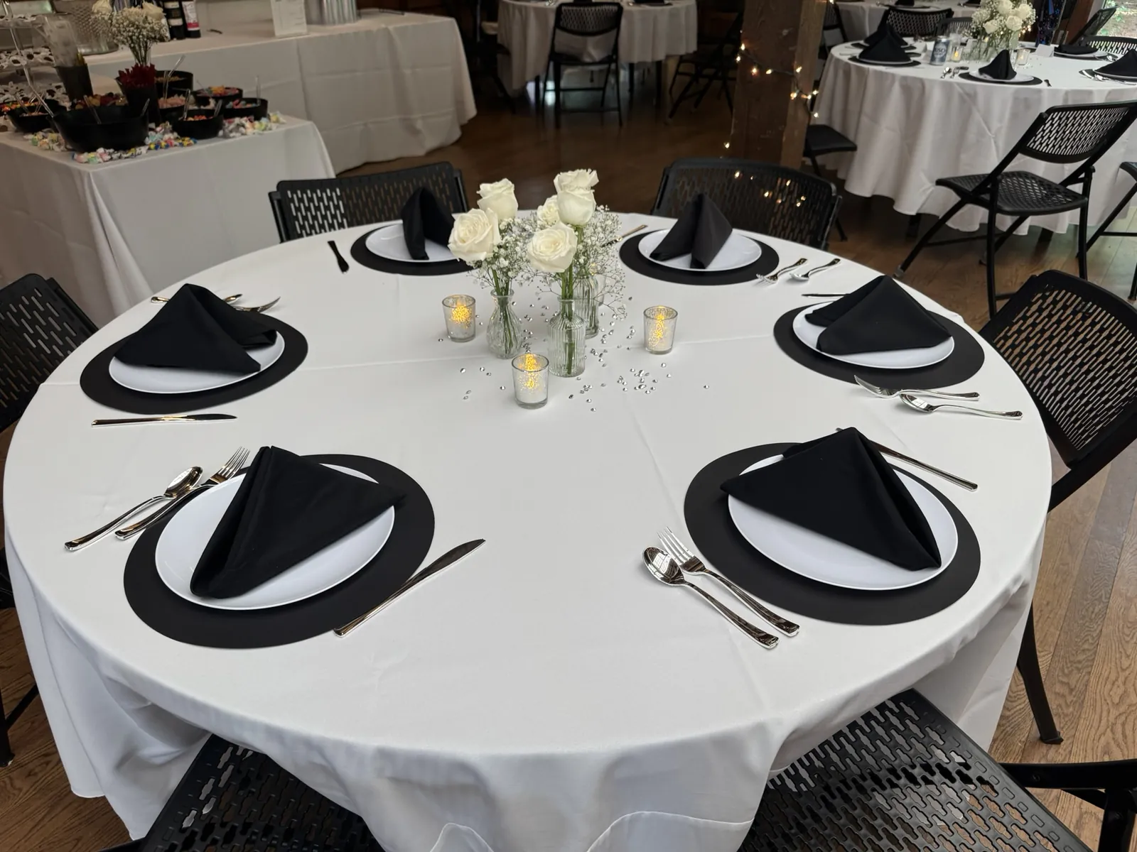 Round tables set for an outdoor catered event