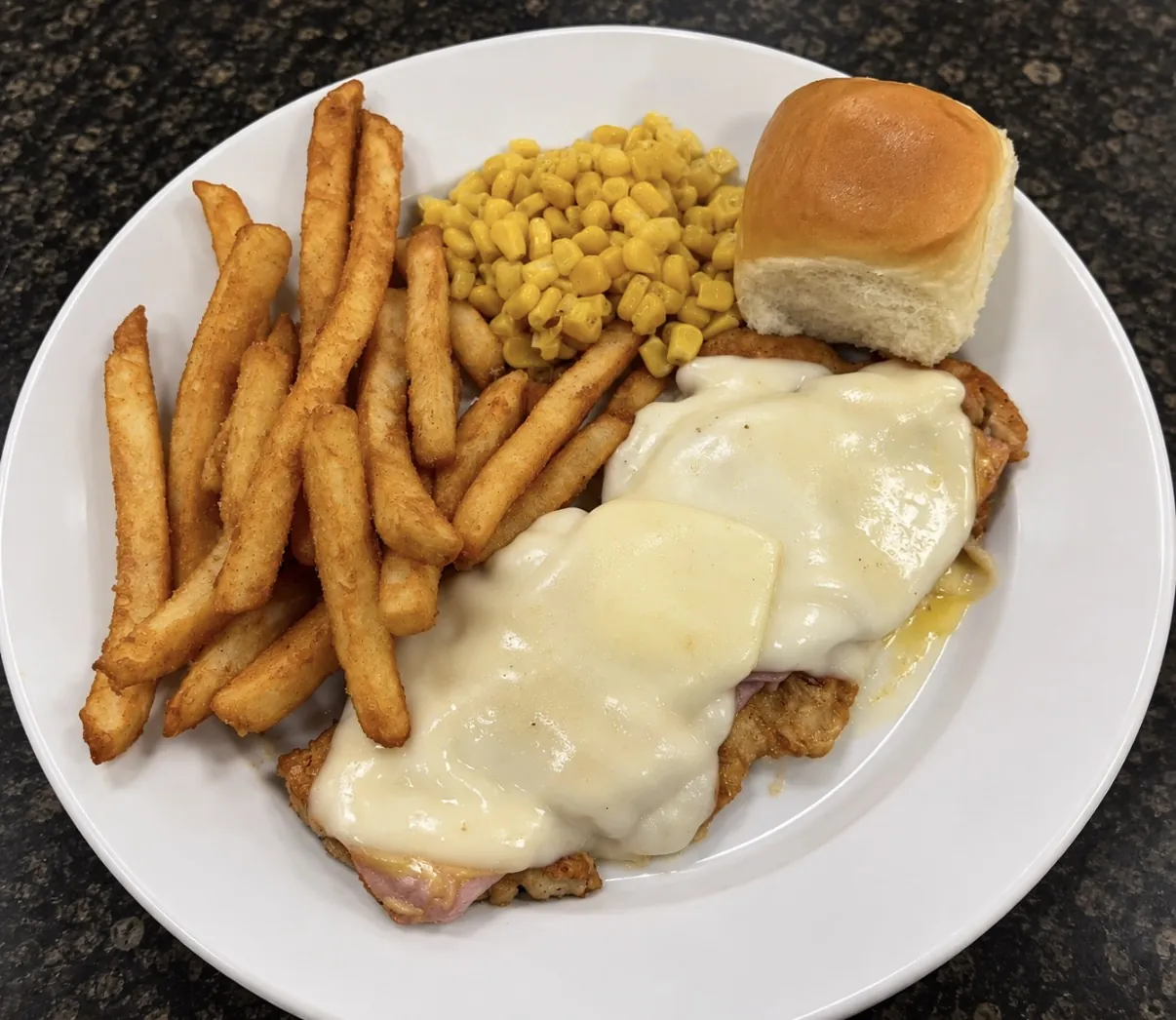 Chicken cordon bleu with fries, corn and a dinner roll at Funkheizer's