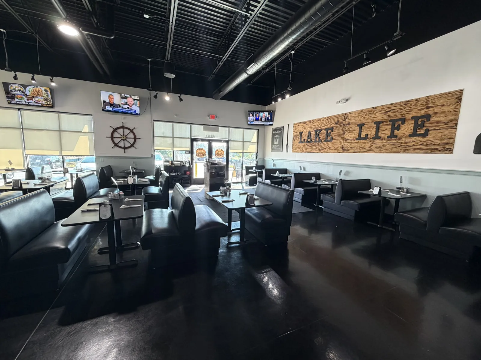 The Funkheizer's Huntersville dining room with the Lake Life sign