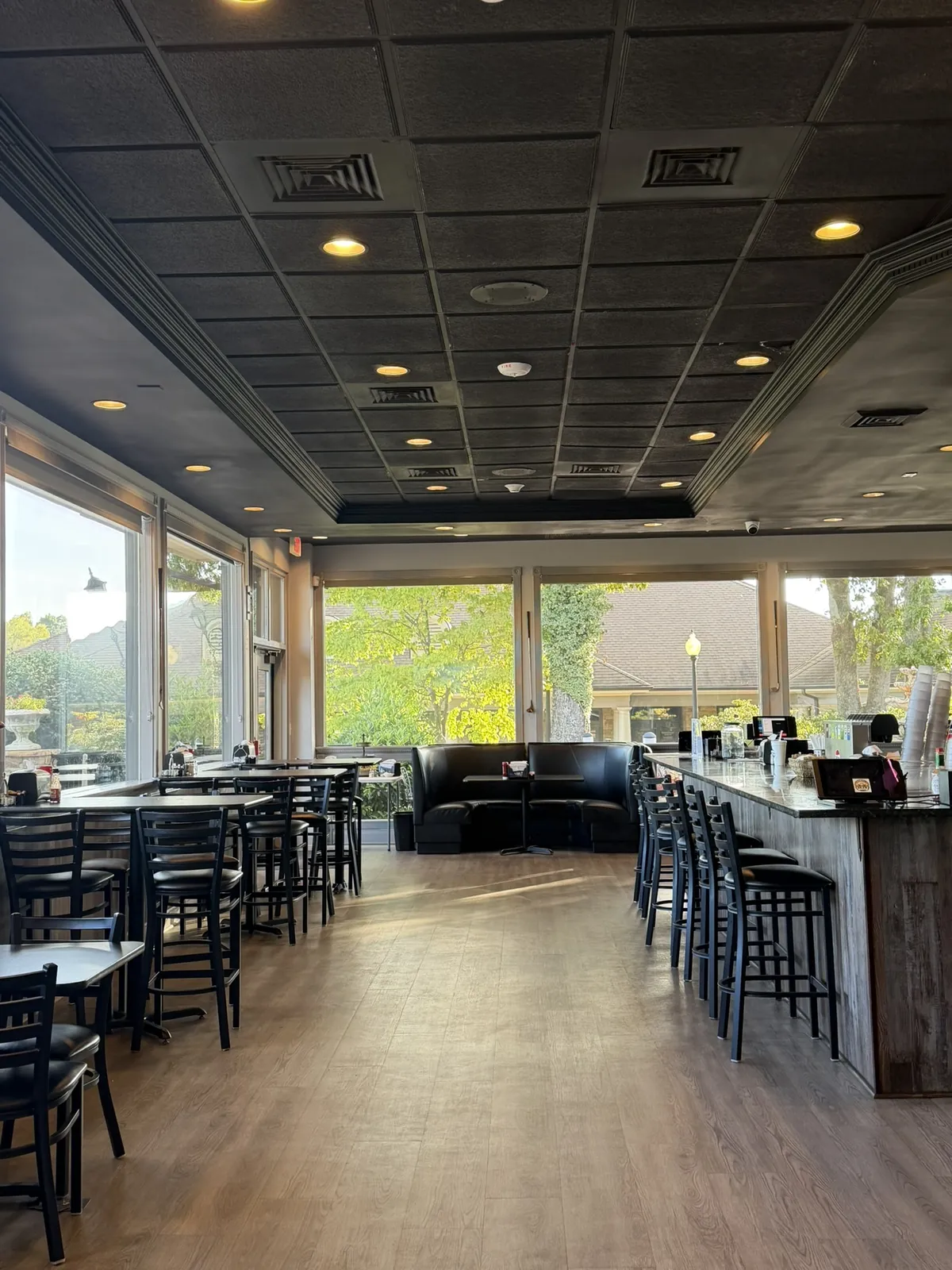 The dining room at Funkheizer's 19th at Rock Barn, with the golf course beyond the windows